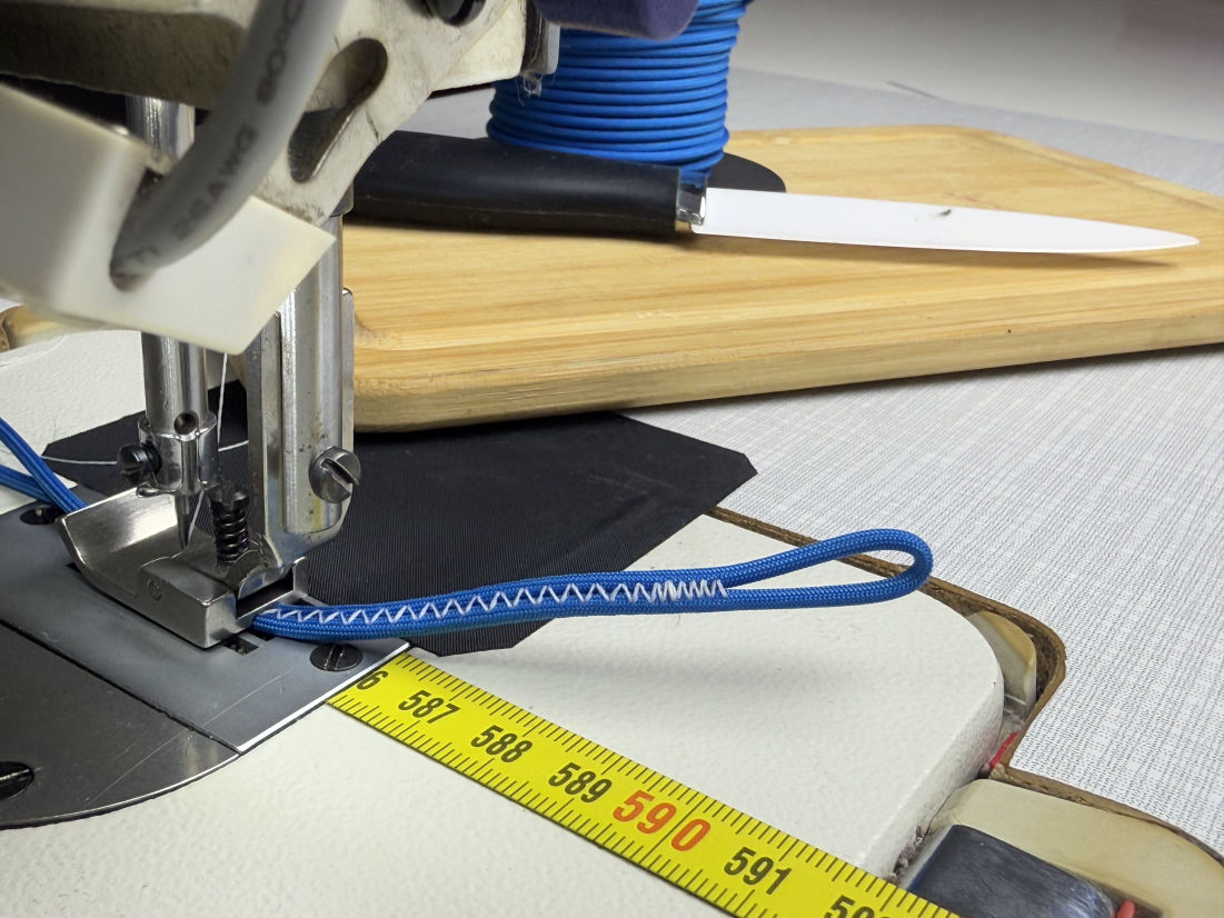 Repairing red and blue paraglider