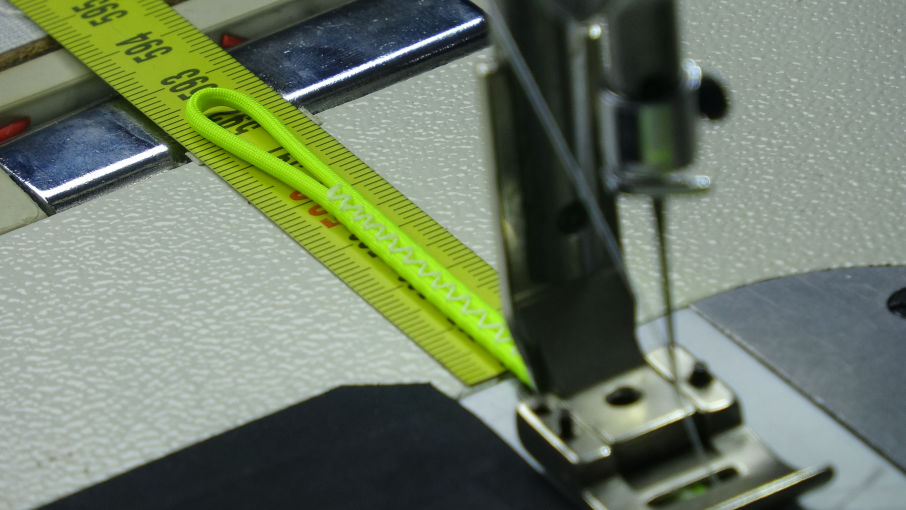 Repairing red and blue paraglider